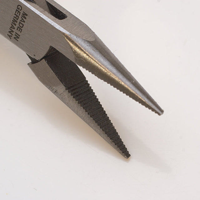 4-1/2 inch serrated chain nose pliers with precise jaws and blue vinyl handles made in Germany